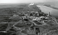 Aerial black and white photo showing Hanford Nuclear reservation buildings and the proximity to the Columbia River