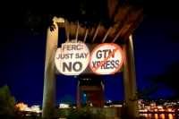 signs that say "FERC JUST SAY NO" and "GTN XPRESS" with a red strike through the words