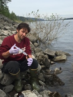Patrick Haluska collecting water quality samples.