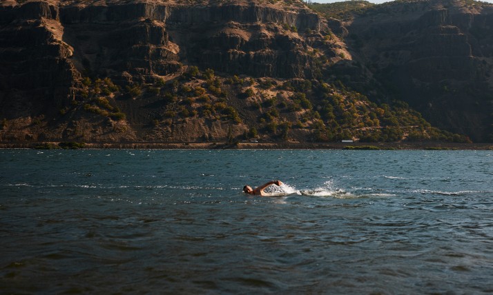 Former Executive Director Brett VandenHeuvel swimming in the Columbia River