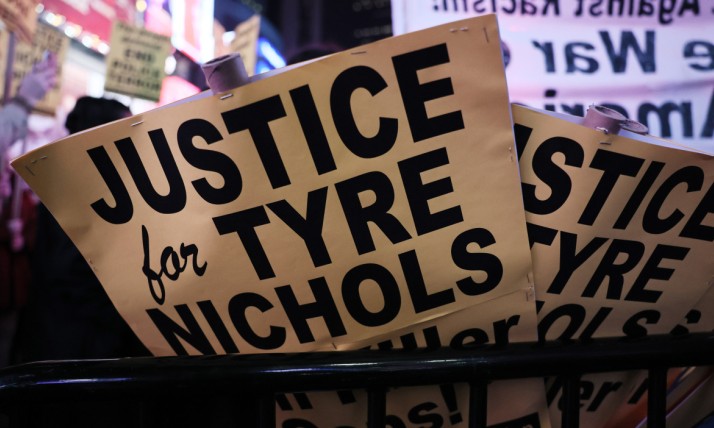 Protest signs read "justice for tyre nichols"