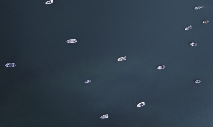 drone image of boats fishing on the Columbia River, deep blue water with tiny boats
