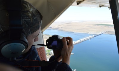Senior Attorney, Miles Johnson, flying over McNary Dam. Aerial support from Lighthawk