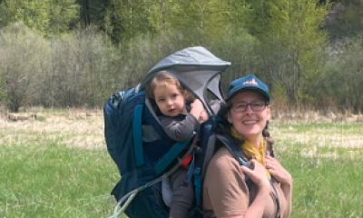 Liz Terhaar, Communications Director, hiking with her dog, Blaze, and daughter, Zuma in Montana; photo credit: Jon Terhaar.